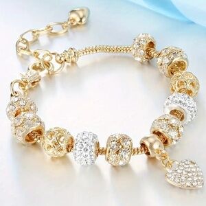 Elegant Gold and Silver Charm Bracelet